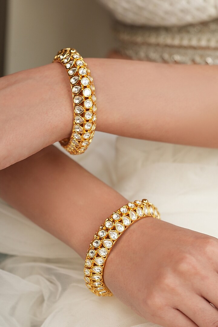 Gold Finish Kundan Polki & Floral Motif Kadas (Set Of 2) by Joules By Radhika at Pernia's Pop Up Shop