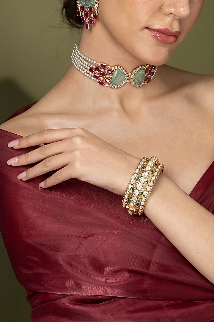 Gold Finish Green Stone Bangle by Joules By Radhika at Pernia's Pop Up Shop