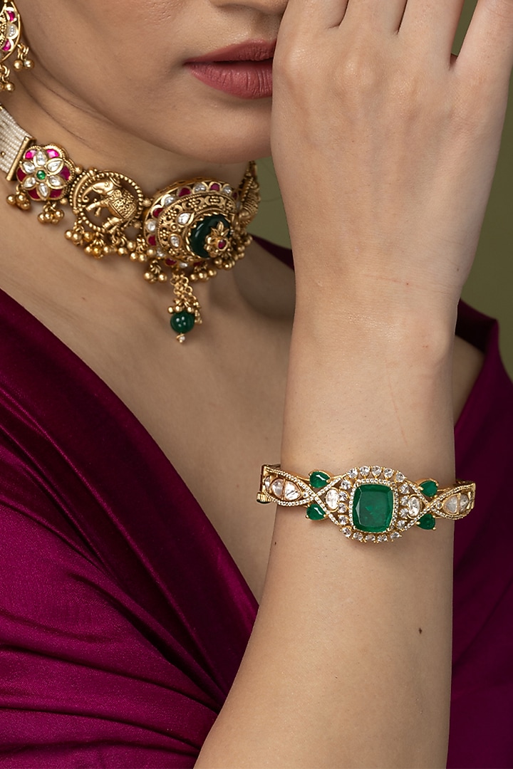 Gold Finish Emerald Green Stone Bangle by Joules By Radhika at Pernia's Pop Up Shop
