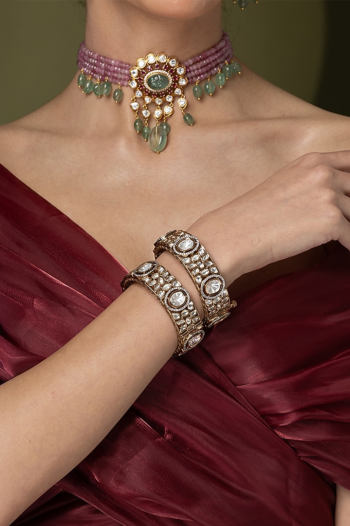 Gold Finish Uncut Clear Stone Bangles (Set Of 2) by Joules By Radhika at Pernia's Pop Up Shop