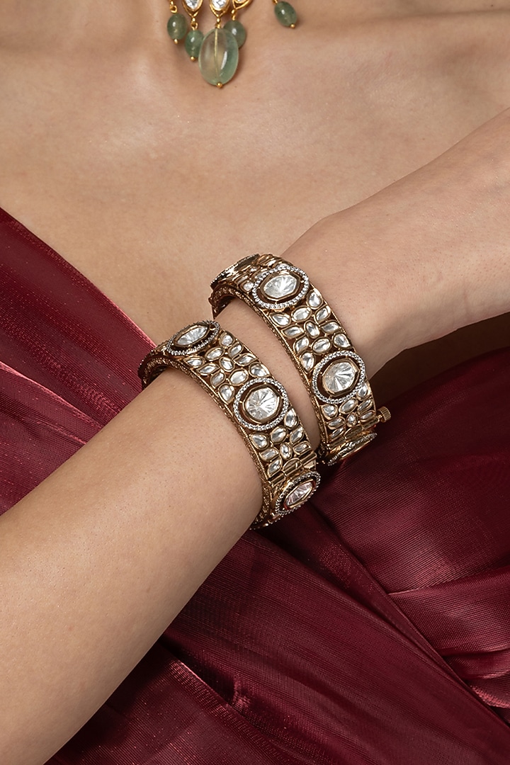 Gold Finish Uncut Clear Stone Bangles (Set Of 2) by Joules By Radhika at Pernia's Pop Up Shop