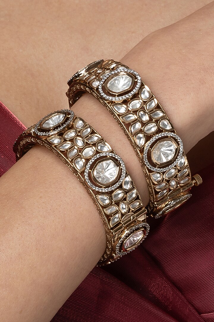 Gold Finish Uncut Clear Stone Bangles (Set Of 2) by Joules By Radhika at Pernia's Pop Up Shop