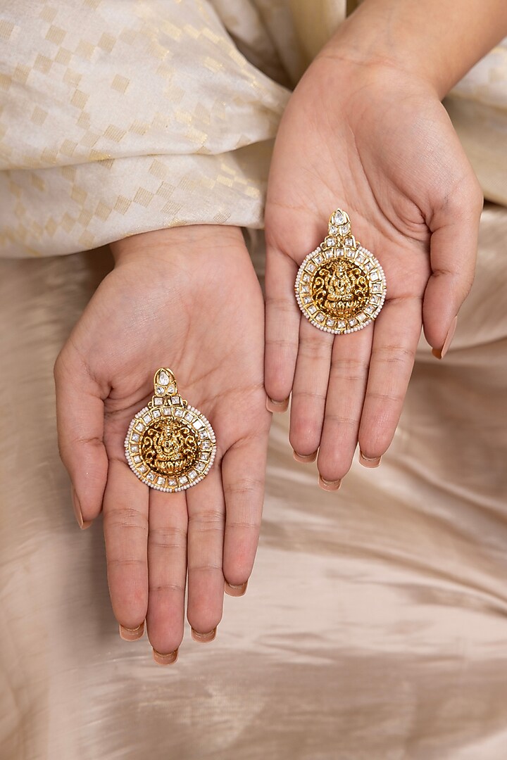 Gold Finish Floral & Goddess Motif Temple Dangler Earrings by Joules By Radhika at Pernia's Pop Up Shop