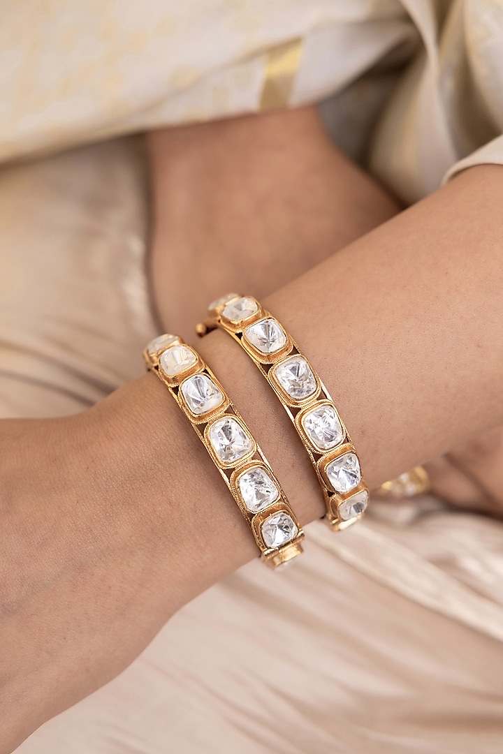 Gold Finish Kundan Polki & Pearl Bangles (Set Of 2) by Joules By Radhika at Pernia's Pop Up Shop