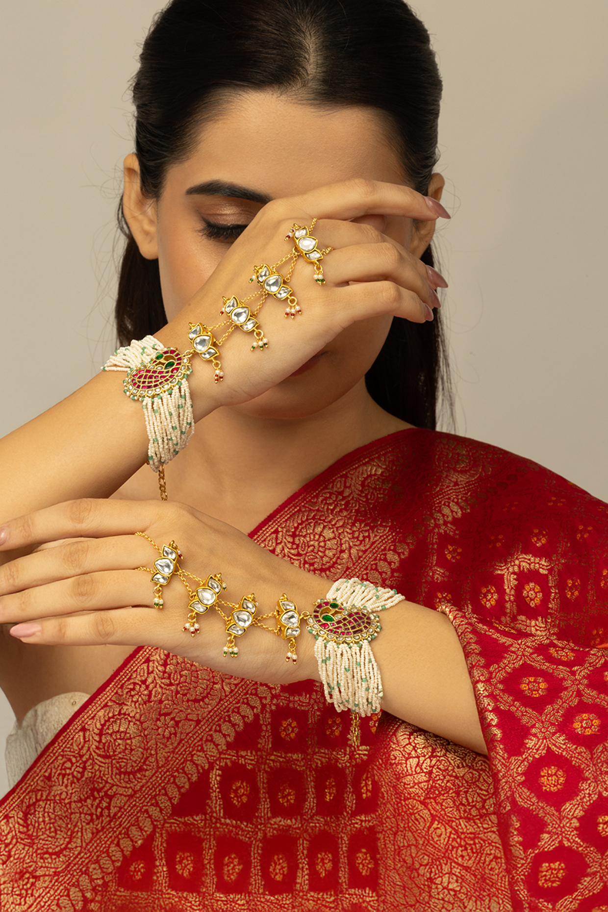 Gold Finish Kundan Polki & White Beaded Zavira Haathphool by Joules By Radhika