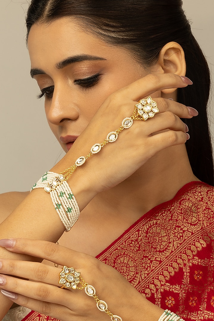 Gold Finish Kundan Polki & White Beaded Navya Haathphool by Joules By Radhika at Pernia's Pop Up Shop