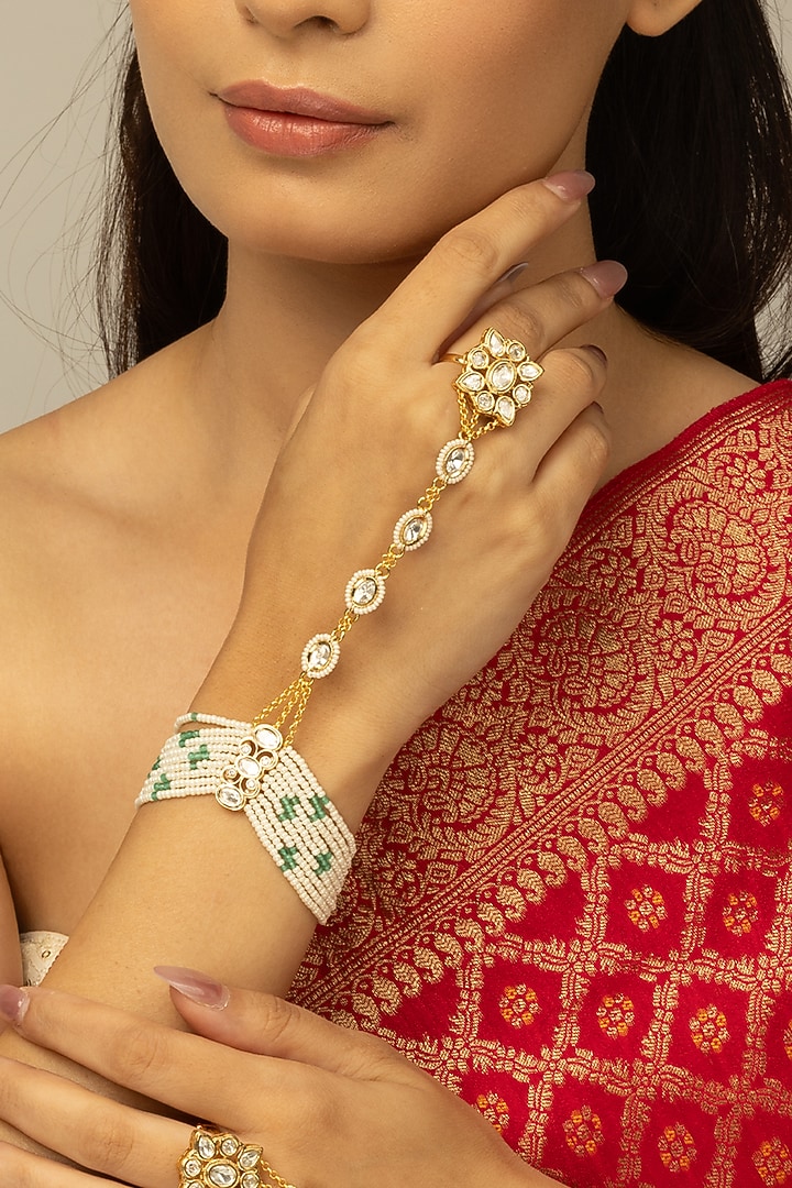 Gold Finish Kundan Polki & White Beaded Navya Haathphool by Joules By Radhika at Pernia's Pop Up Shop