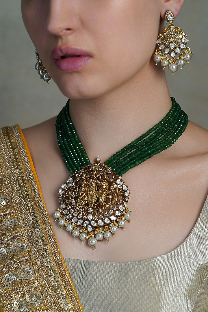 Yellow Gold Finish Emerald Stone Temple Necklace Set by Joules By Radhika at Pernia's Pop Up Shop