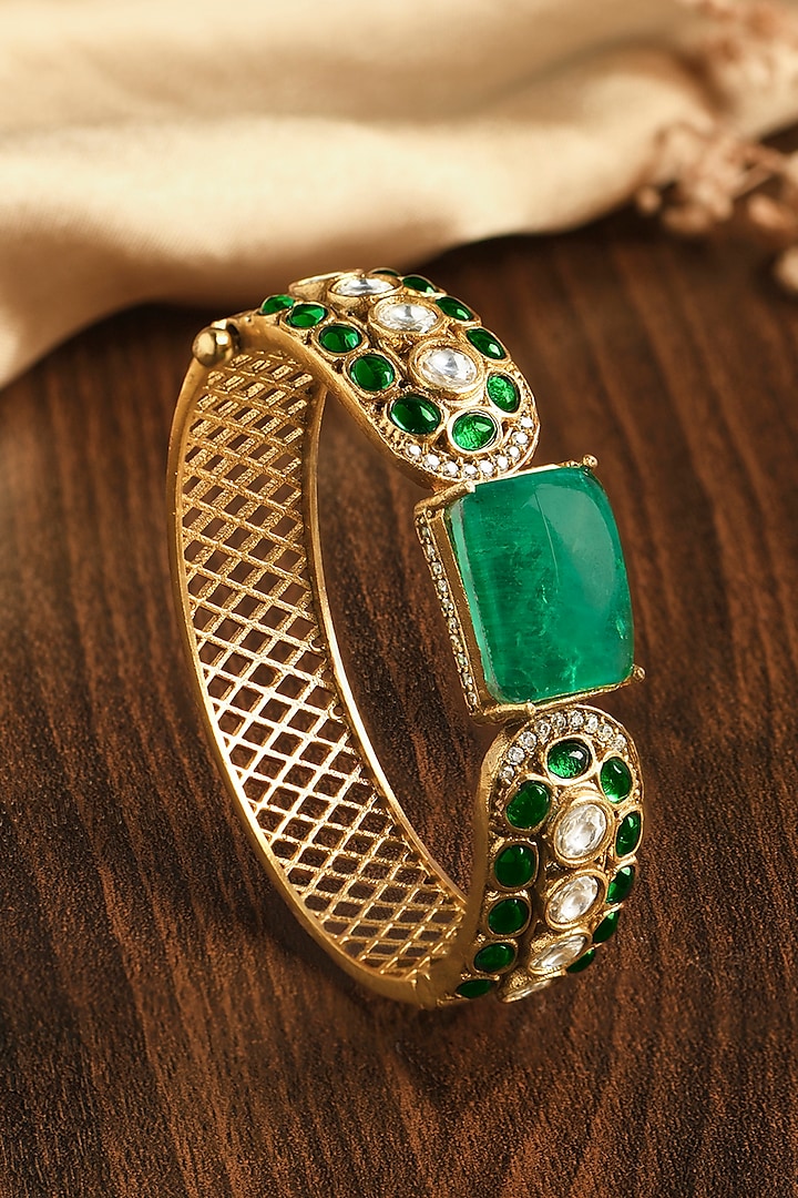 Gold Finish Emerald Stone Kada by Joules By Radhika at Pernia's Pop Up Shop