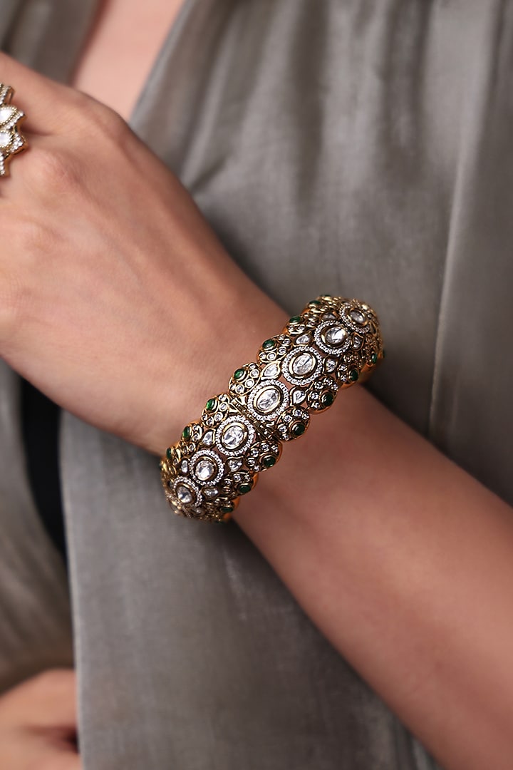 Yellow Gold Finish Sapphire Stone Bangle by Joules By Radhika at Pernia's Pop Up Shop