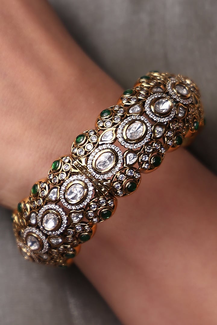 Yellow Gold Finish Sapphire Stone Bangle by Joules By Radhika at Pernia's Pop Up Shop