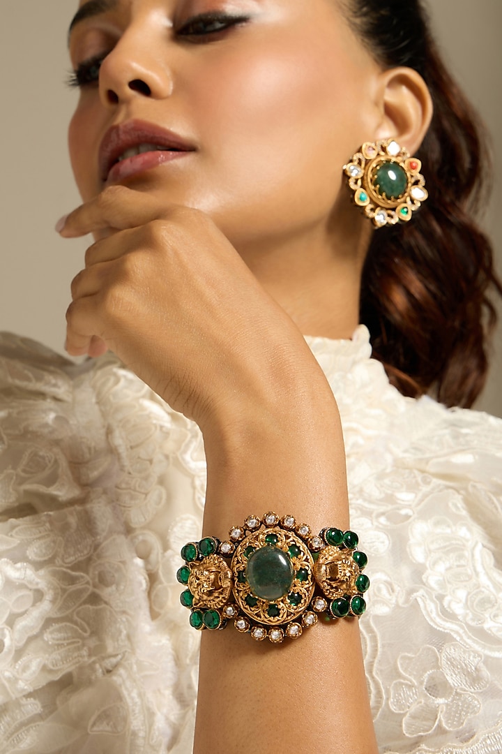 Gold Finish Motifs & Green Stone Bracelet by Joules By Radhika at Pernia's Pop Up Shop