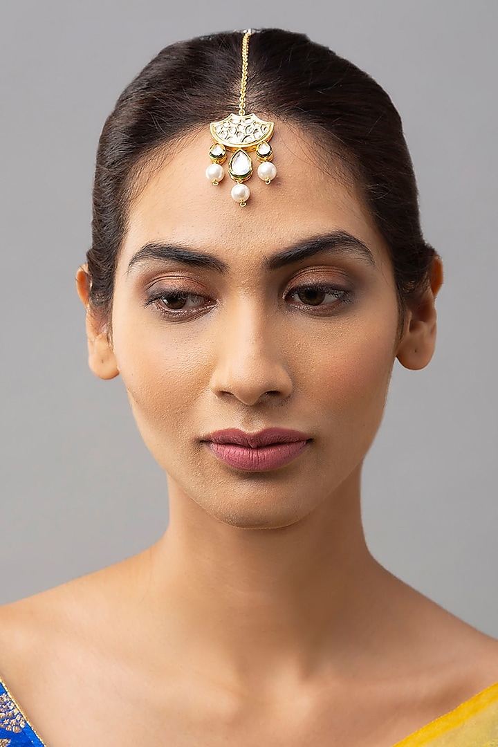 Gold Finish Maang Tikka With Shell Pearls by Joules By Radhika