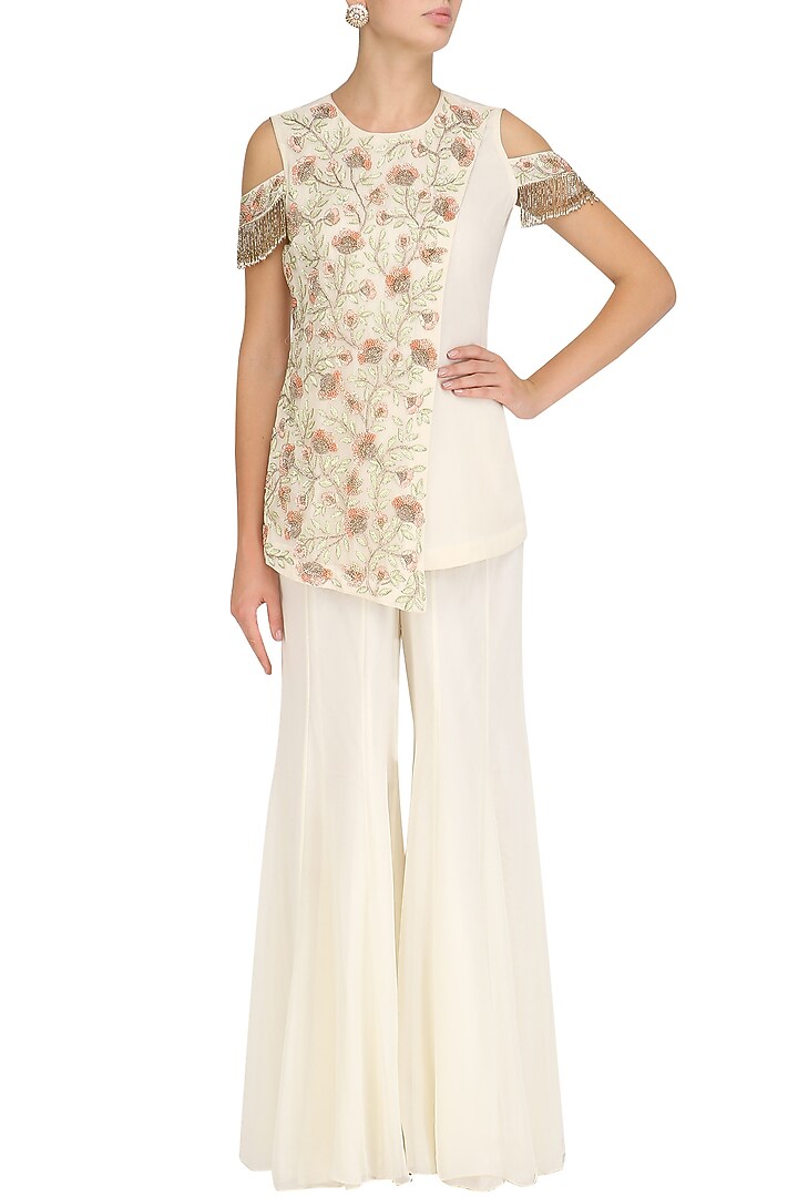 Ivory floral embroidered kurta and sharara pants set available only at Pernia's Pop Up Shop.