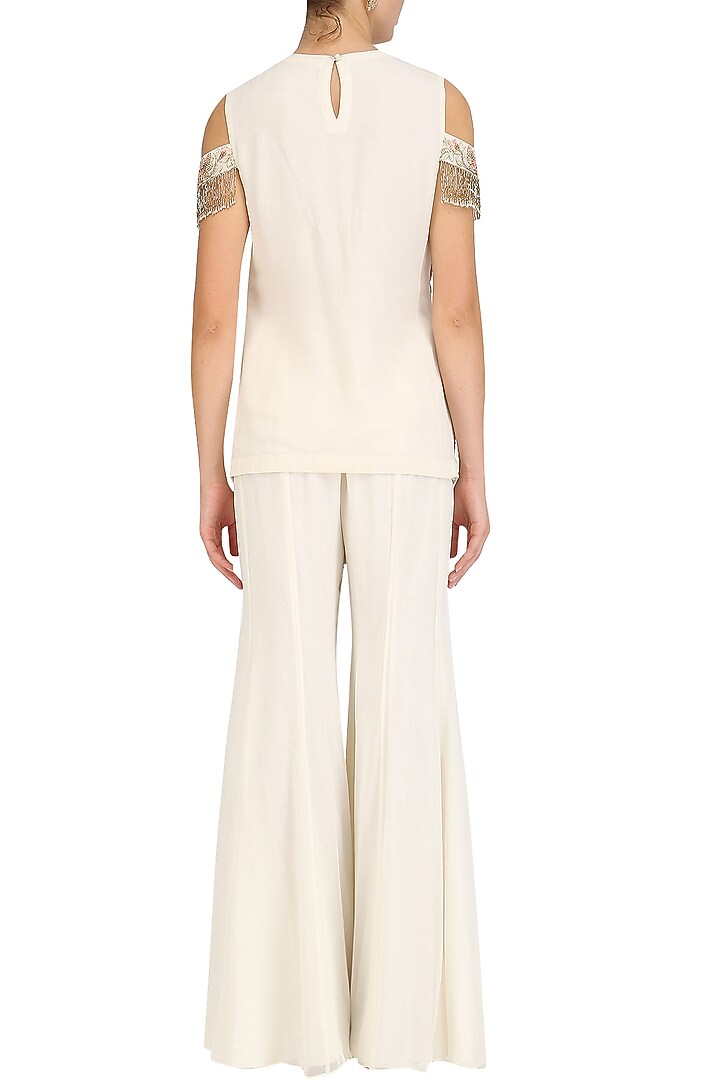 Ivory floral embroidered kurta and sharara pants set available only at Pernia's Pop Up Shop.
