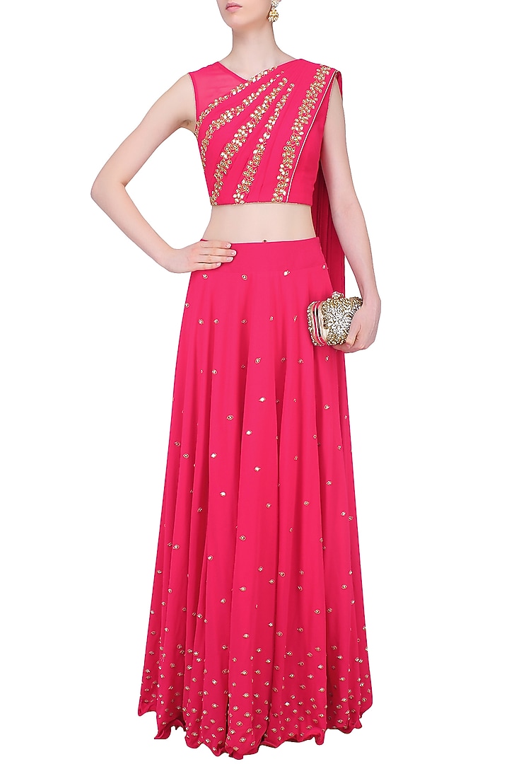 Reddish pink mirror work blouse with attached dupatta and skirt available only at Pernia's Pop Up Shop.
