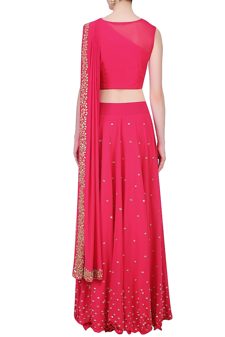 Reddish pink mirror work blouse with attached dupatta and skirt available only at Pernia's Pop Up Shop.