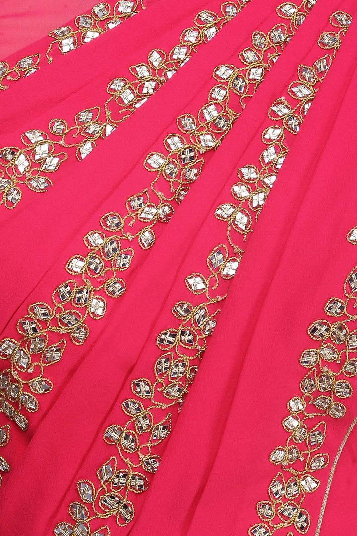 Reddish pink mirror work blouse with attached dupatta and skirt available only at Pernia's Pop Up Shop.