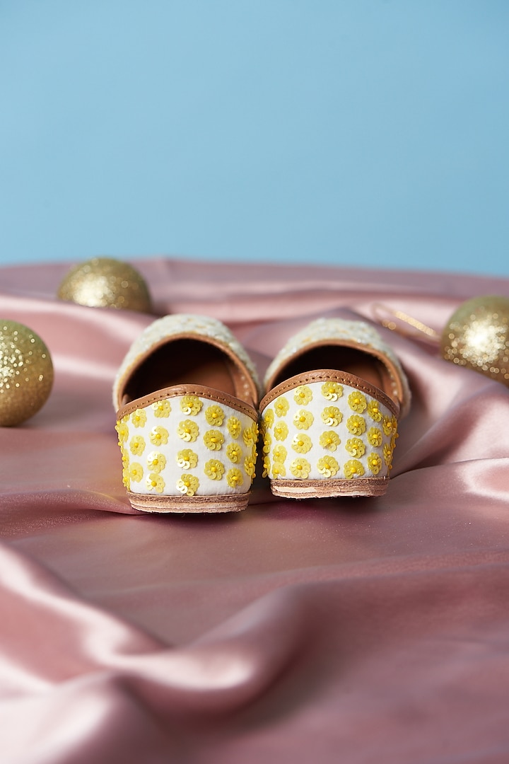 Yellow & Ivory Cotton Silk Thread Embellished Juttis For Girls by Jekwats at Pernia's Pop Up Shop