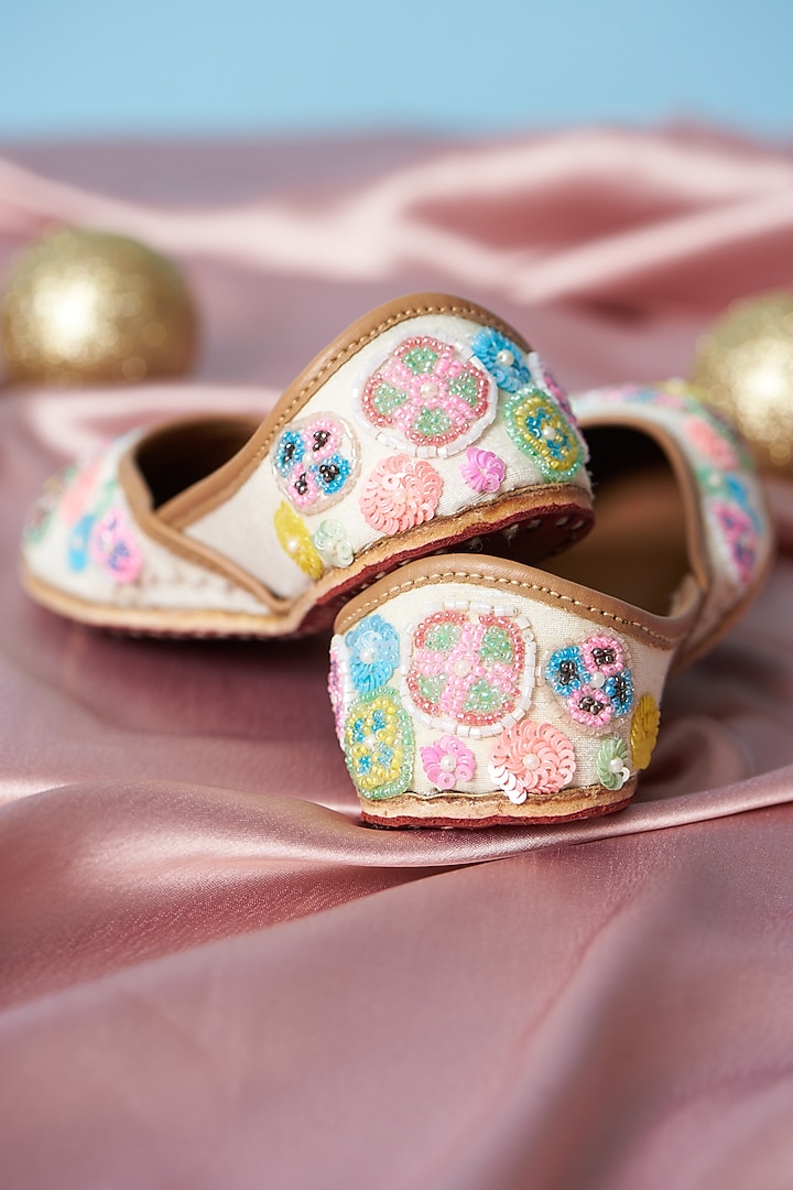 Ivory Pure Leather Sequins Embroidered Juttis For Girls by Jekwats at Pernia's Pop Up Shop