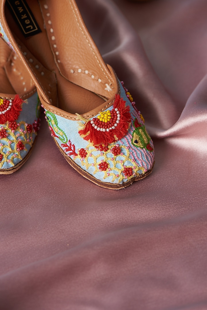 Ice Blue Pure Leather Thread Embroidered Juttis For Girls by Jekwats at Pernia's Pop Up Shop
