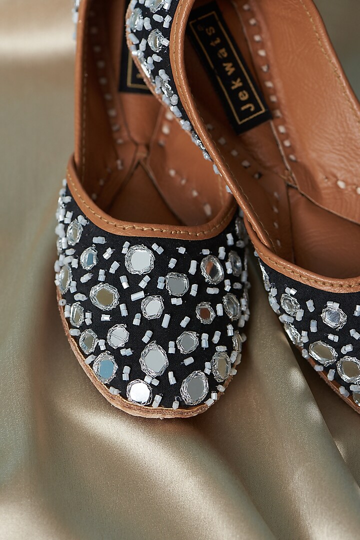 Black Pure Leather Mirror Embellished Juttis For Girls by Jekwats at Pernia's Pop Up Shop