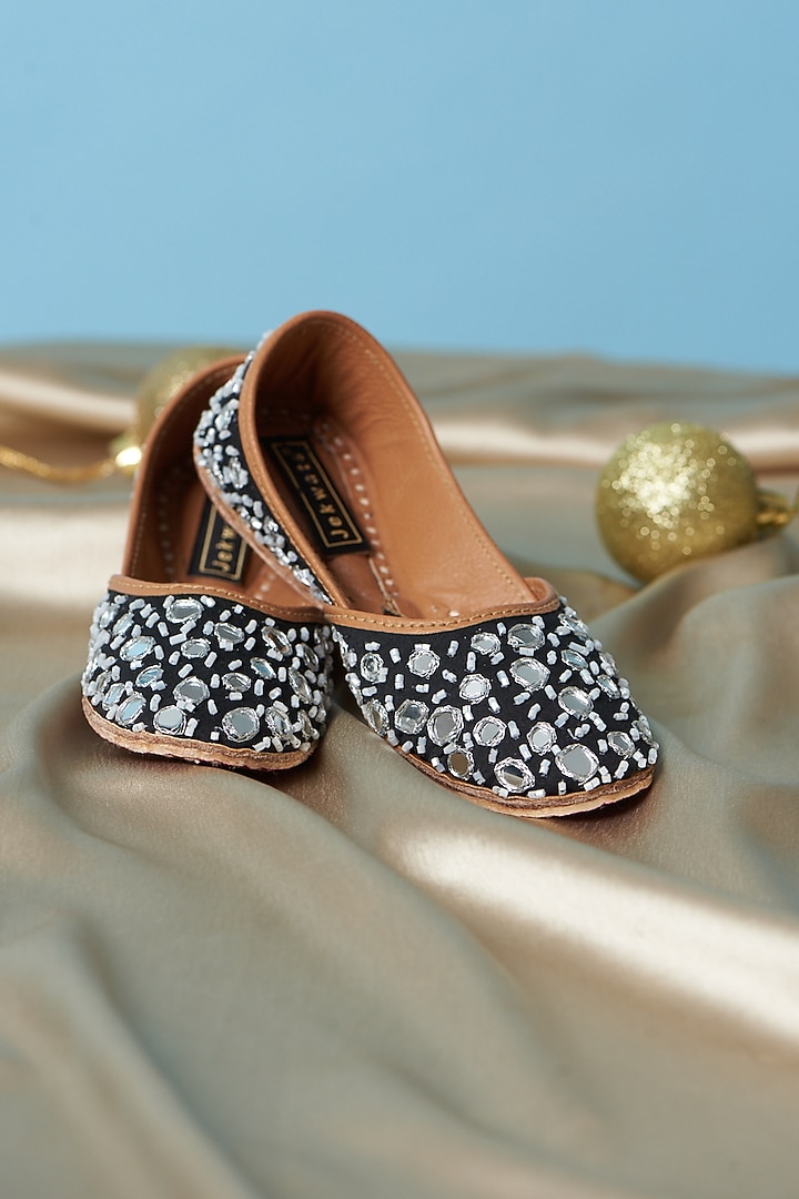 Black Pure Leather Mirror Embellished Juttis For Girls by Jekwats at Pernia's Pop Up Shop