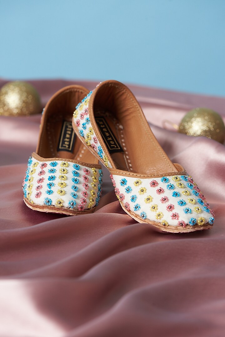 Ivory Pure Leather Beads Embellished Juttis For Girls by Jekwats at Pernia's Pop Up Shop