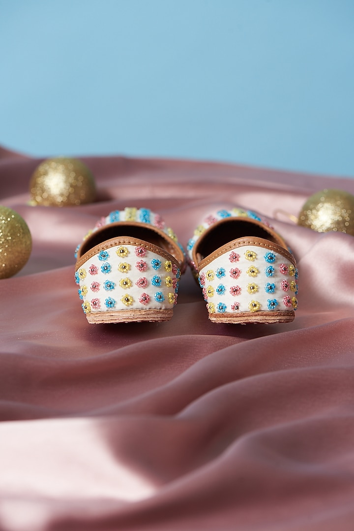 Ivory Pure Leather Beads Embellished Juttis For Girls by Jekwats at Pernia's Pop Up Shop