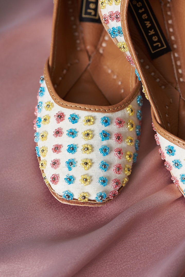 Ivory Pure Leather Beads Embellished Juttis For Girls by Jekwats at Pernia's Pop Up Shop