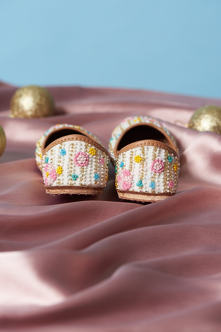 Ivory Pure Leather Beads Embroidered Juttis For Girls by Jekwats at Pernia's Pop Up Shop
