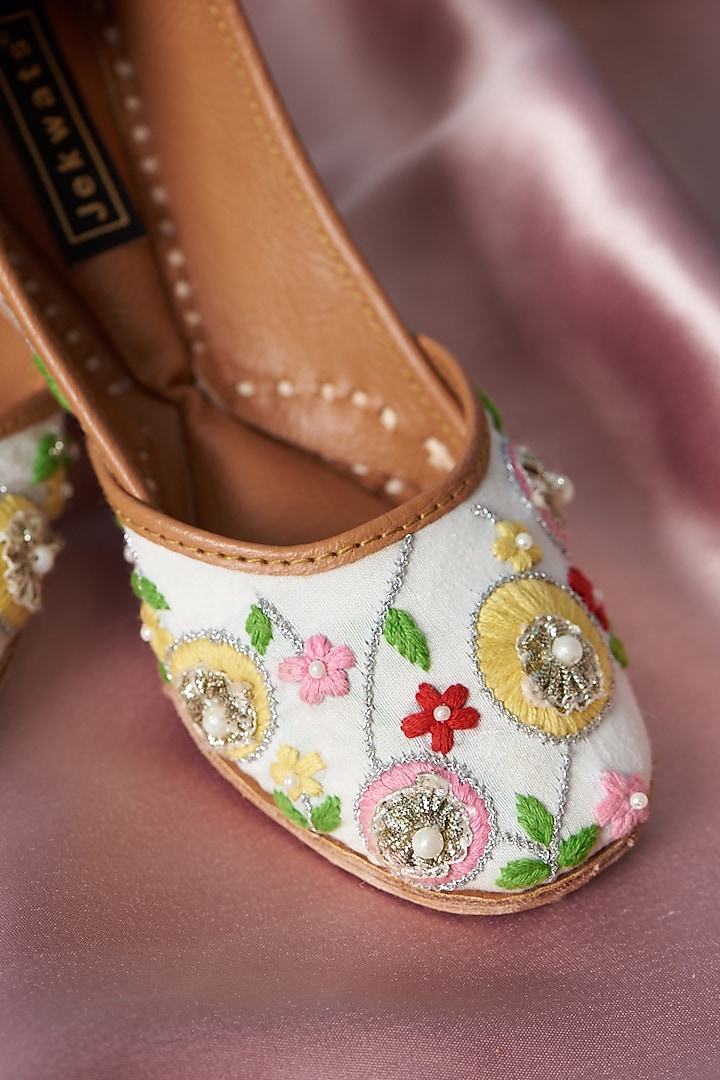 Ivory Pure Leather Thread Embellished Juttis For Girls by Jekwats at Pernia's Pop Up Shop