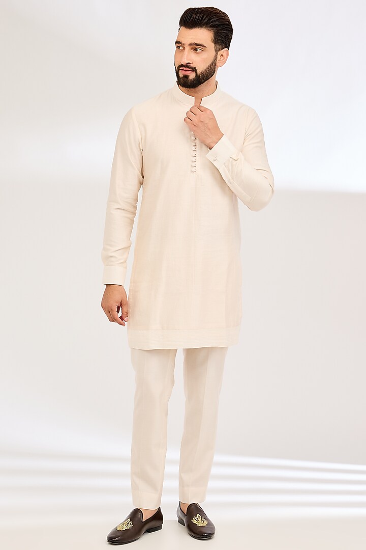 Peach Raw Silk Embroidered Groom Bandhgala Set by Sarab Khanijou at Pernia's Pop Up Shop