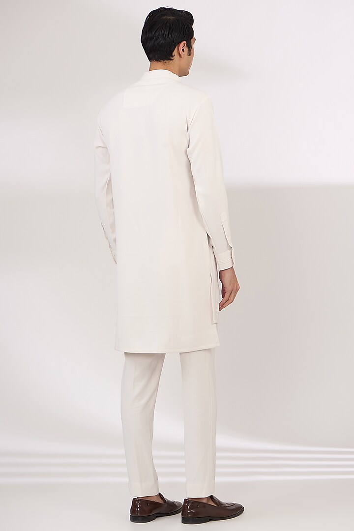 Ivory Sandwash Cutdana Embroidered Pintuck Kurta Set by Sarab Khanijou at Pernia's Pop Up Shop
