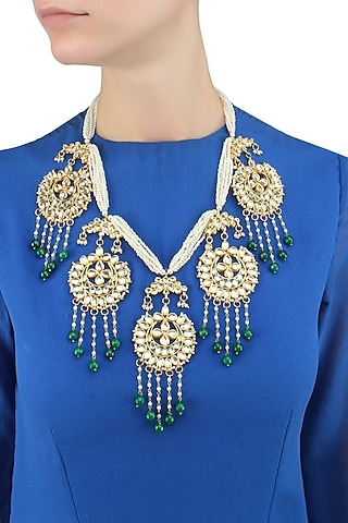Gold finish crescent motif hanging pearl string necklace by Just Shraddha