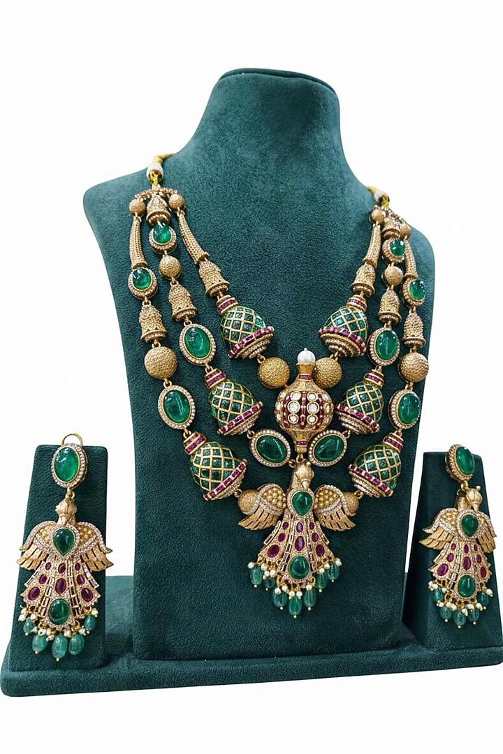 Gold Finish Uncut Polki & Emerald Layered Necklace Set by JewelTreeTz at Pernia's Pop Up Shop