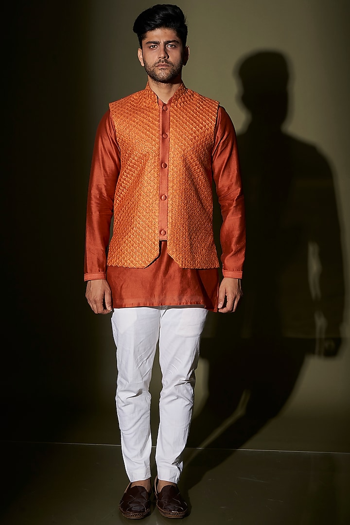 Rust Thread Embroidered Bundi Jacket With Kurta Set by KAAJ Button