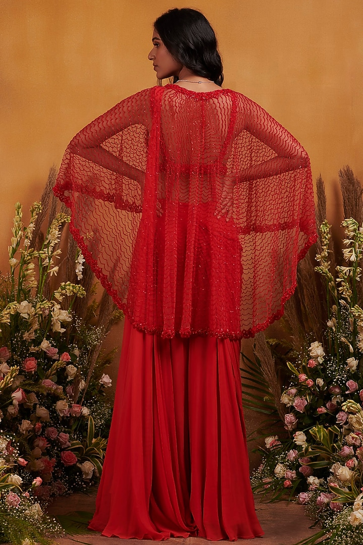 Red Embellished Jumpsuit With Cape by K&A By Karishma And Ashita at Pernia's Pop Up Shop