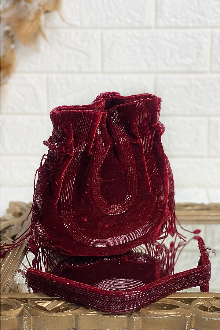 Maroon Sequins & Pearl Embellished Potli by Kainiche by Mehak at Pernia's Pop Up Shop