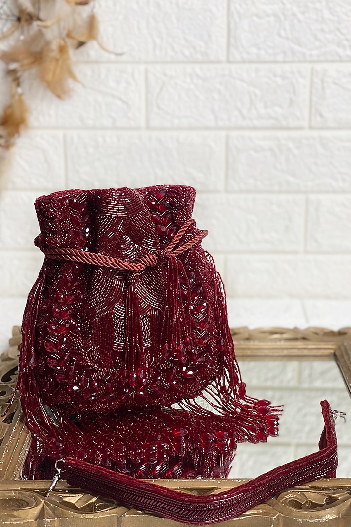 Maroon Sequins & Pearl Embellished Potli by Kainiche by Mehak at Pernia's Pop Up Shop