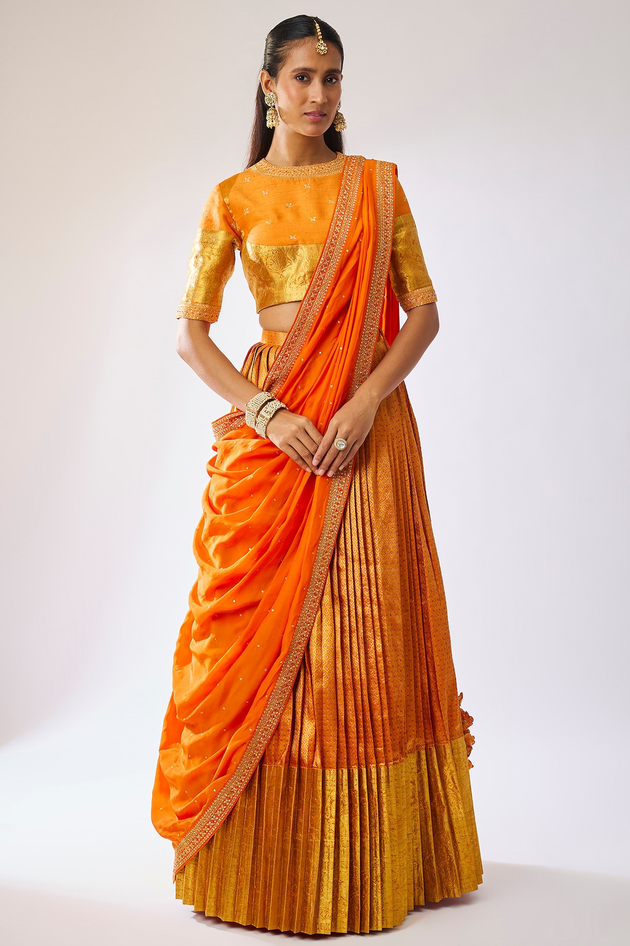 Orange Pattu Silk Zari Embroidered Bridal Lehenga Set by Kavitha