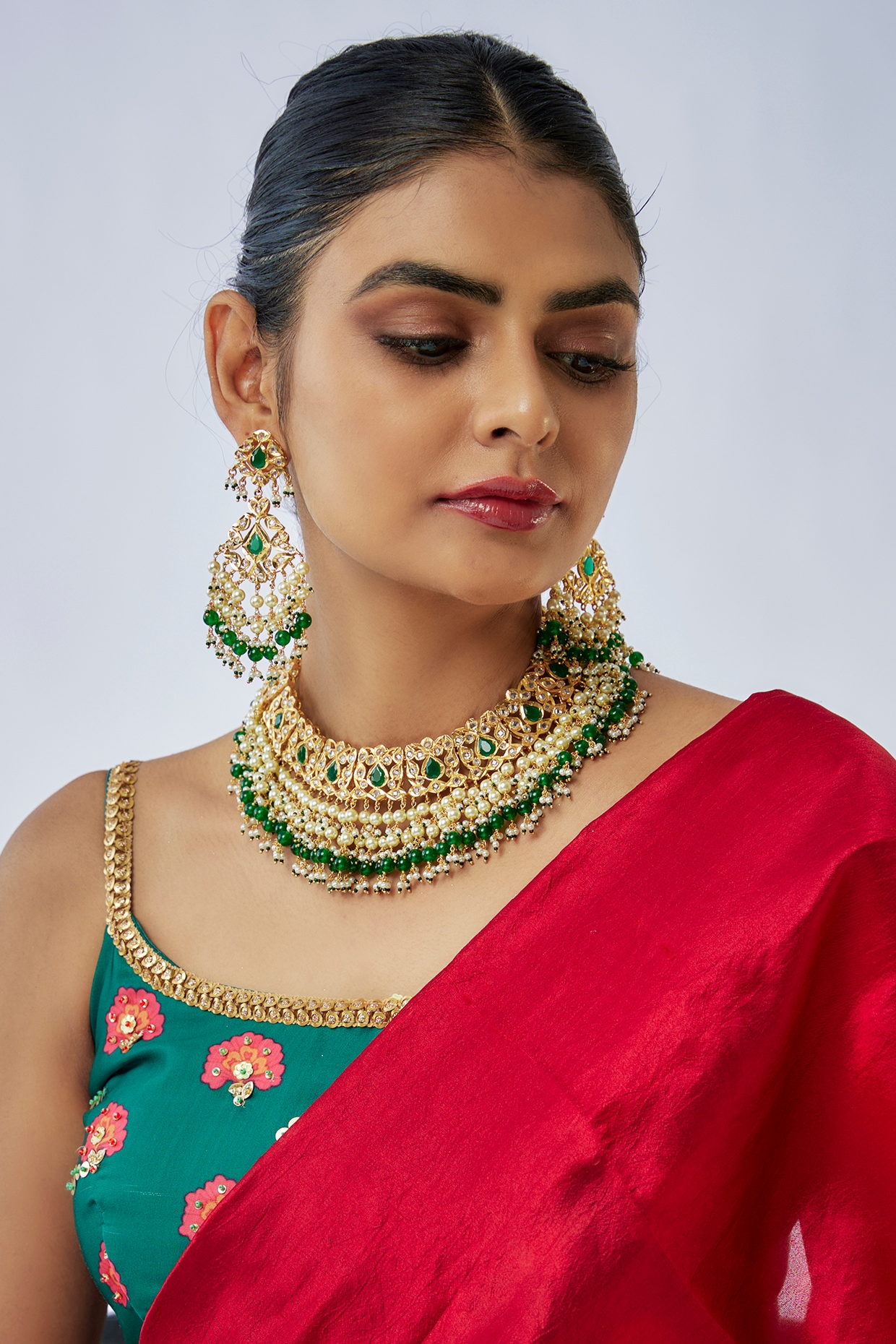 Her #RedLehenga with the Combination of Green #Jewellery and soft subtle  #Makeup makes for a … | Designer bridal lehenga choli, Fashion dresses  online, Red lehenga