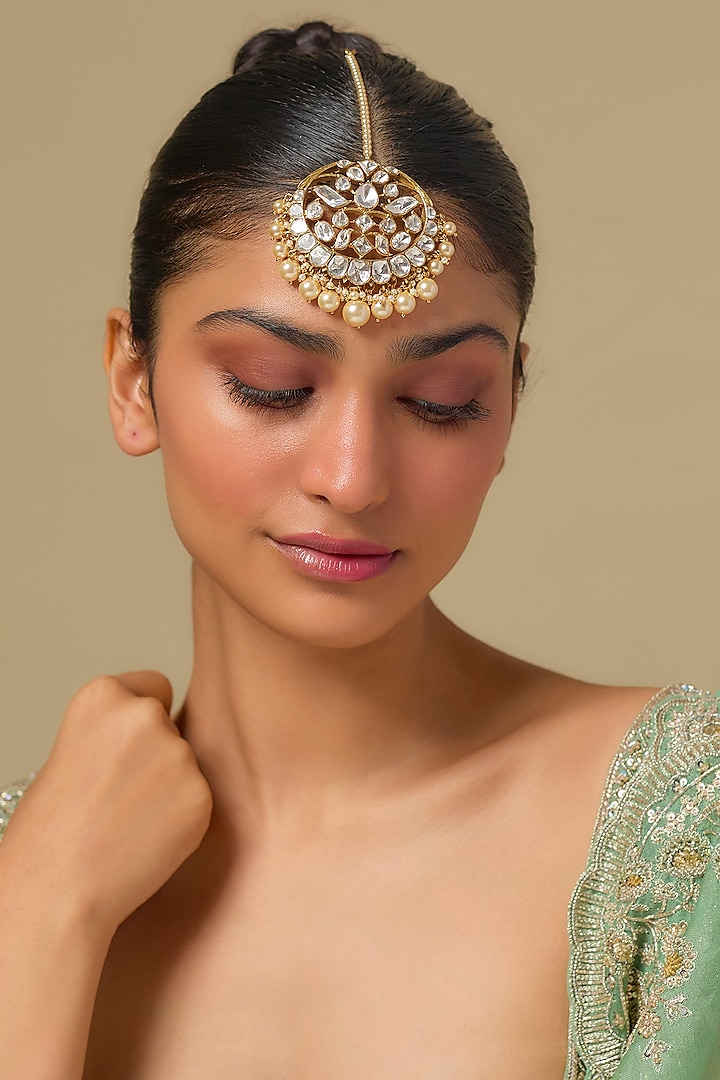 Gold Finish Kundan Polki & Pearl Maangtikka In Sterling Silver by Kiara Luxe at Pernia's Pop Up Shop