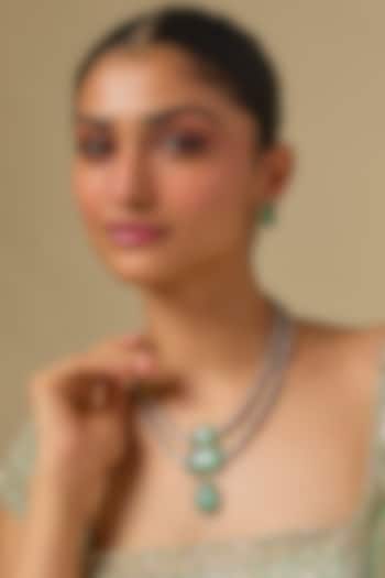 Gold Finish Kundan Polki & Emerald Stone Layered Necklace Set In Sterling Silver by Kiara Luxe at Pernia's Pop Up Shop