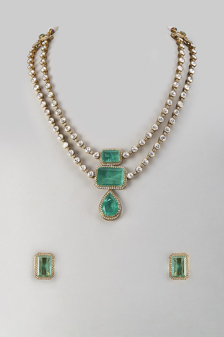Gold Finish Kundan Polki & Emerald Stone Layered Necklace Set In Sterling Silver by Kiara Luxe at Pernia's Pop Up Shop