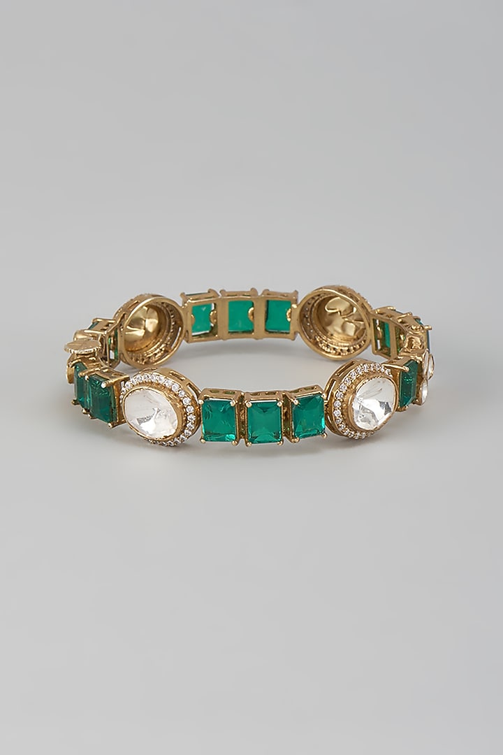 Gold Finish Kundan Polki & Emerald Stone Bracelet In Sterling Silver by Kiara Luxe at Pernia's Pop Up Shop
