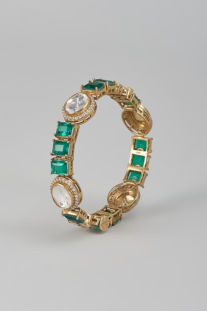 Gold Finish Kundan Polki & Emerald Stone Bracelet In Sterling Silver by Kiara Luxe at Pernia's Pop Up Shop