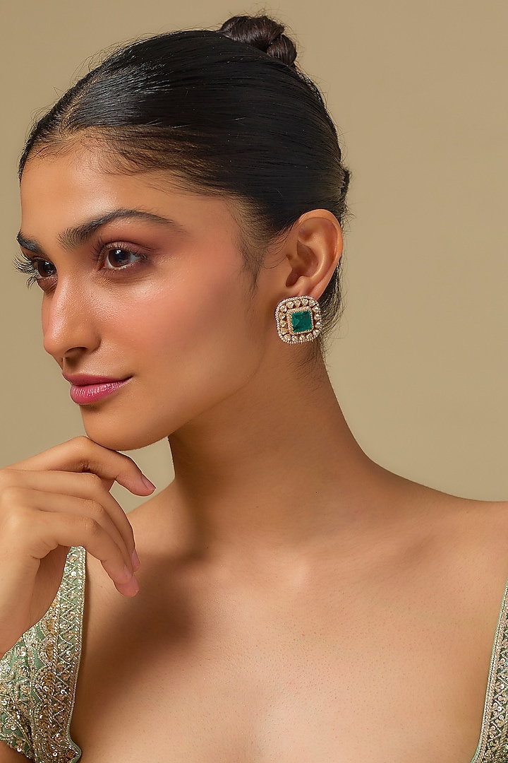 Gold Finish Kundan Polki & Green Stone Stud Earrings In Sterling Silver by Kiara at Pernia's Pop Up Shop