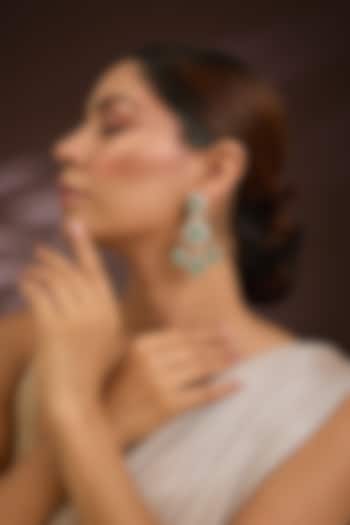 Gold Finish Moissanite Polki & Emerald Green Stone Chandelier Earrings In Sterling Silver by Kiara Luxe at Pernia's Pop Up Shop
