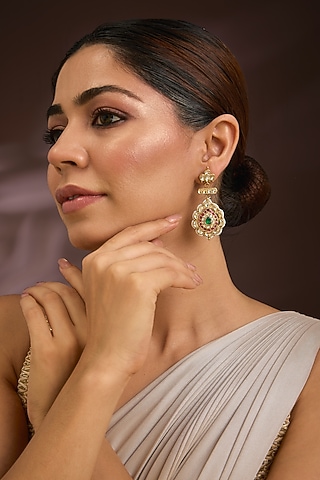 Gold Finish Kundan Polki & Emerald Stone Meenakari Enameled Chandbali Earrings In Sterling Silver by Kiara Luxe